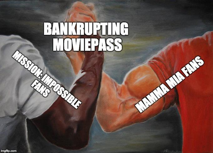A meme of two muscled people arm wrestling; one arm is labeled MISSION IMPOSSIBLE FANS and the other MAMMA MIA FANS, with the joined fists saying BANKRUPTING MOVIEPASS