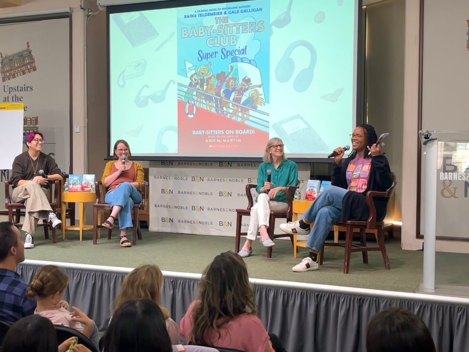 Photograph of Gale Galligan, Raina Telgemeier, Ann M. Martin, and Cassandra Fulton discussing The Baby-Sitters Club Super Special #1 on stage at Barnes & Noble Union Square, NYC.