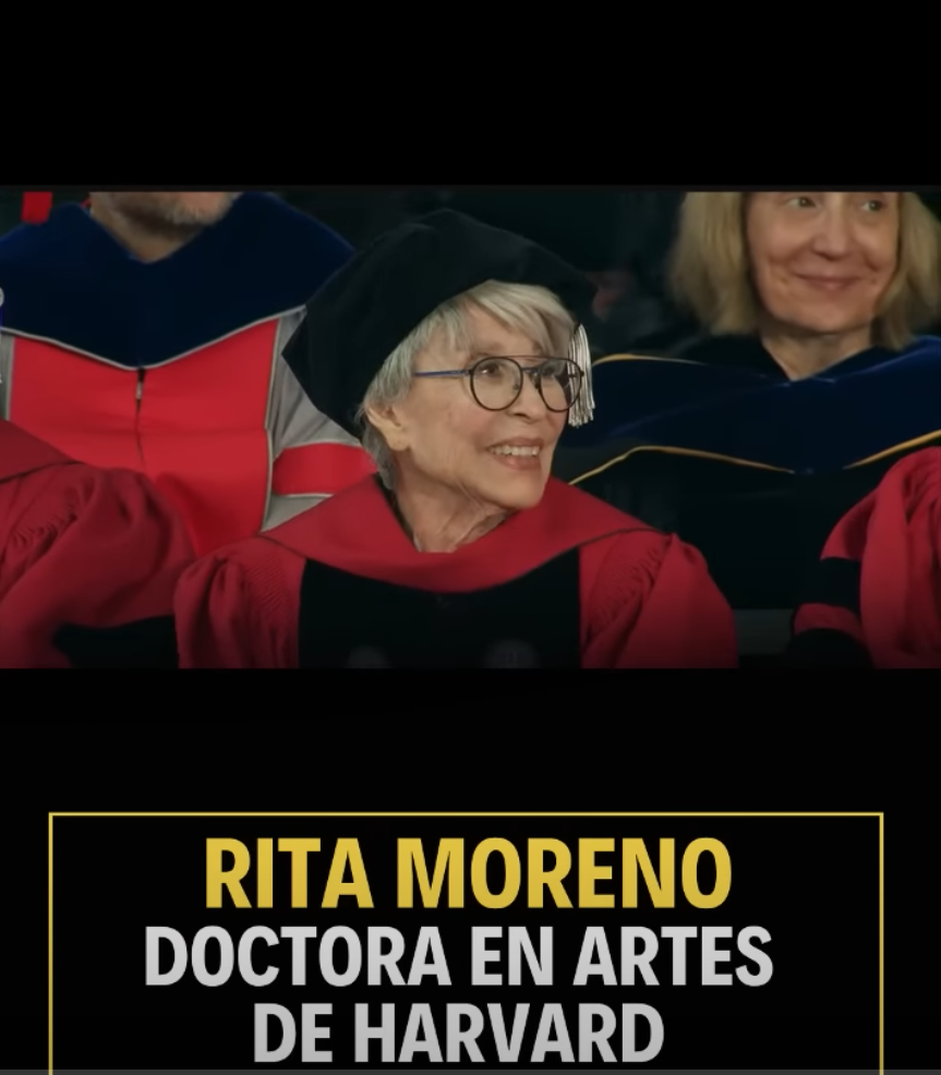 Rita Morena smiling in doctoral robe while being presented honorary doctorate in arts