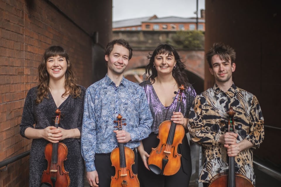 Treske Quartet holding their instruments (two violins, viola and cello).