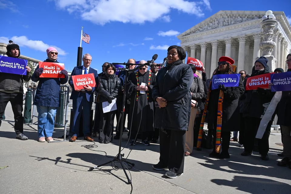 Guerline Jozef, co-founder and executive director of Haitian Bridge Alliance, speaks in front of the Supreme Court last month