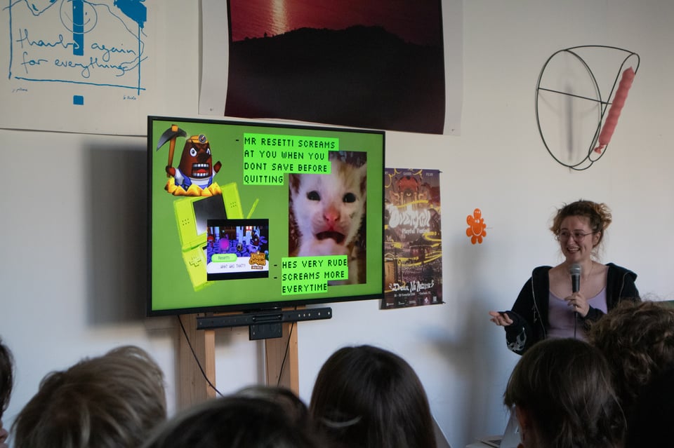 A presenter talking in front of an audience