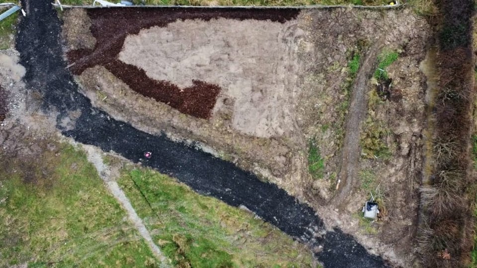 Drone photo of garden in progress, with bark mulch down and new track, by allotment