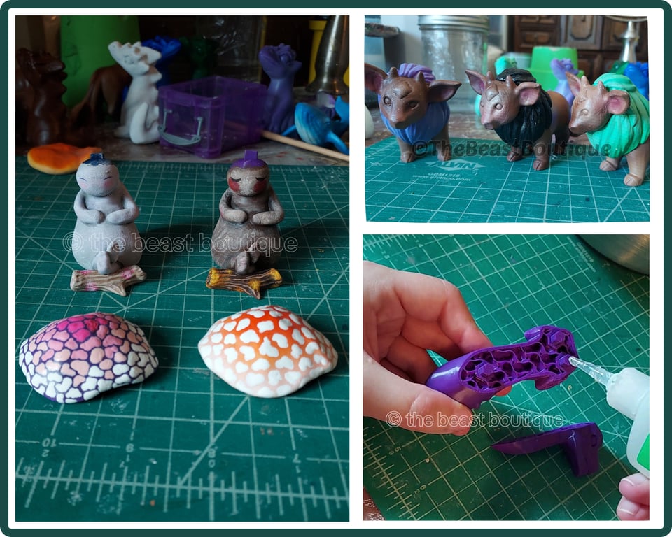 Three photos showing the assembly process for some of my pieces this month, two mushling people with pink and orange caps, three fantasy cows with lion manes, and a 3d print in the middle of assembly.