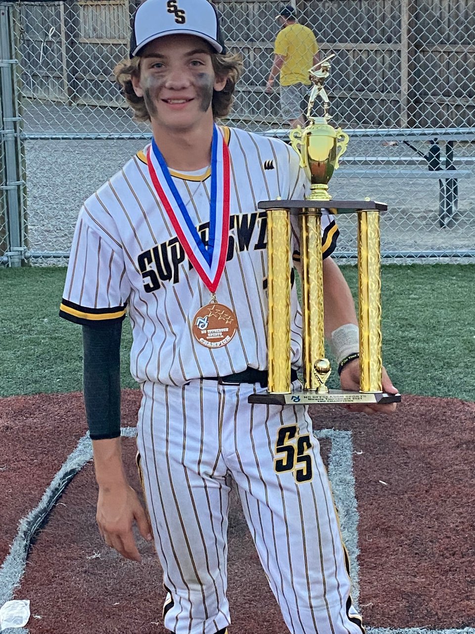 Maverick Baker with his baseball trophy