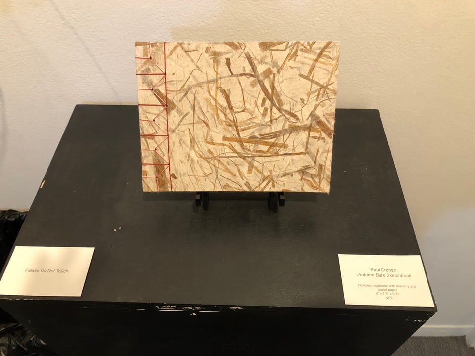 Paul’s hand-bound book mounted and displayed.