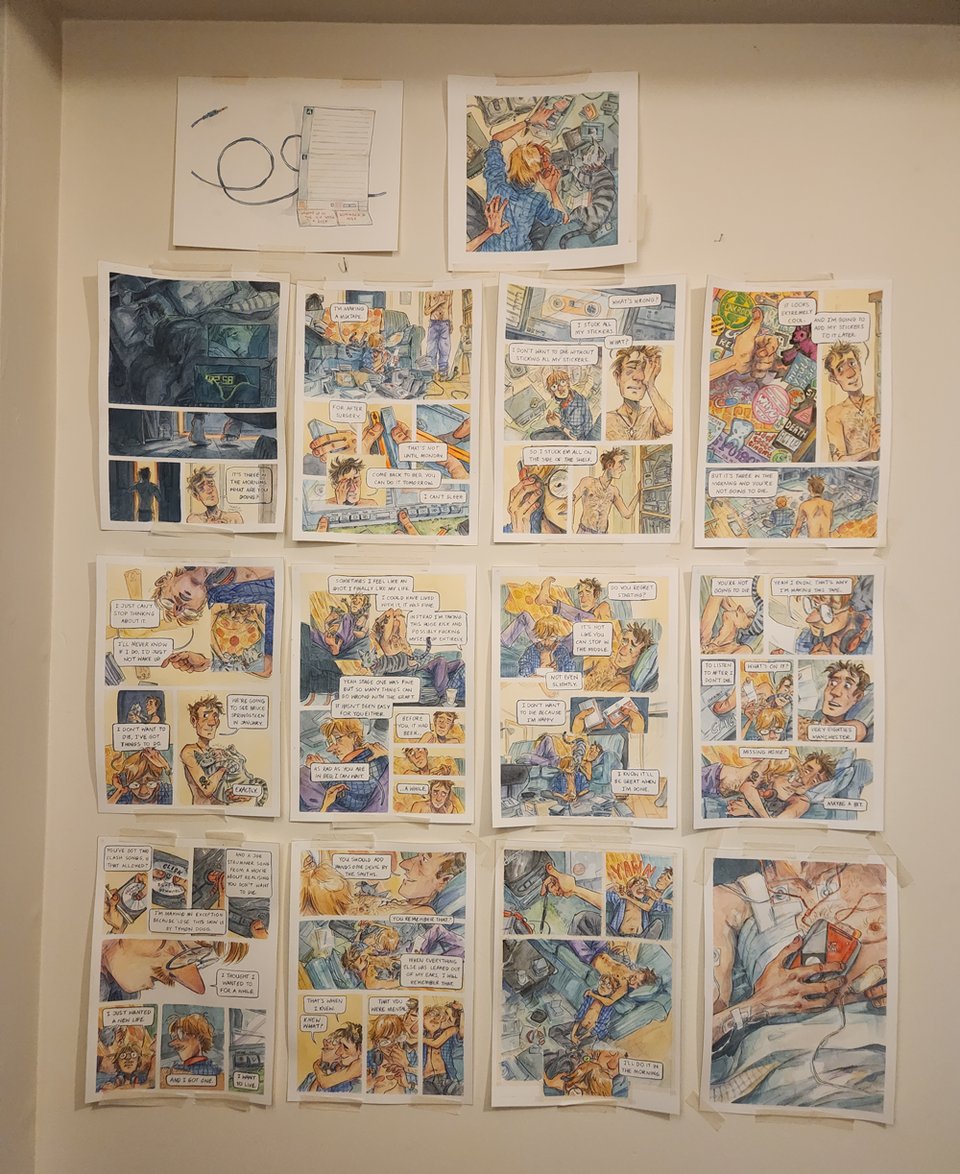 All the physical pages of a watercolour comic taped to a wall.