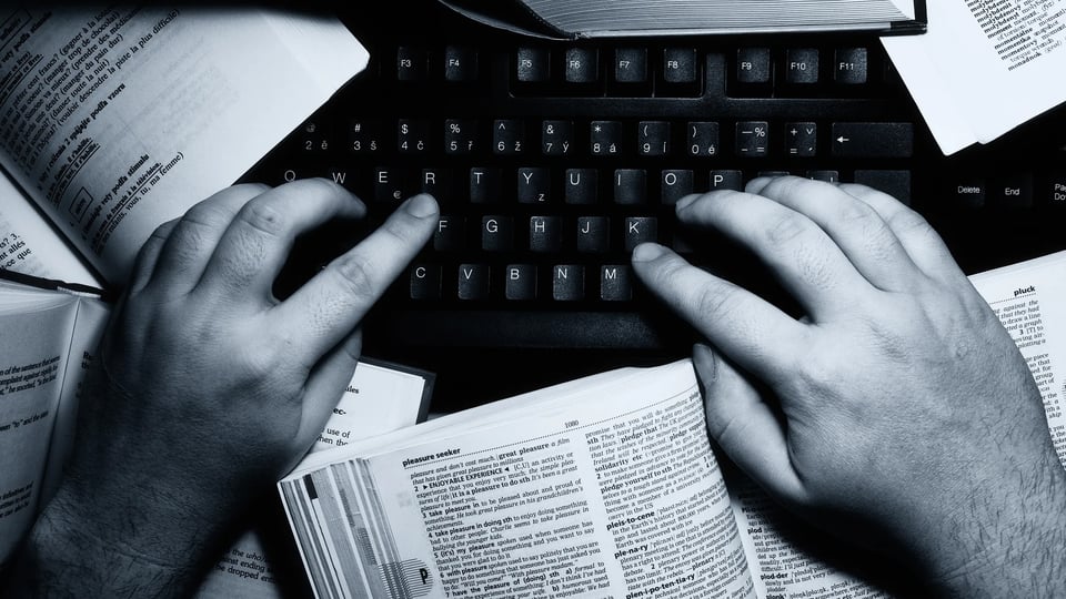 a person typing on a computer