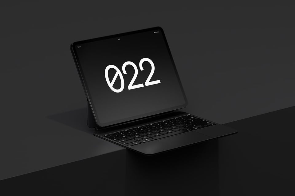 Tablet device with a keyboard sitting on a solid cube