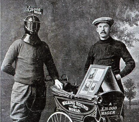 An image of a Harry Bensley in an iron helmet, standing next to a pram and a man not wearing an iron helmet.