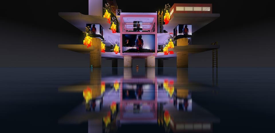 A zoomed-out image of the base of the oil rig from this doof, with screens showing somebody DJing in a hi-vis vest.