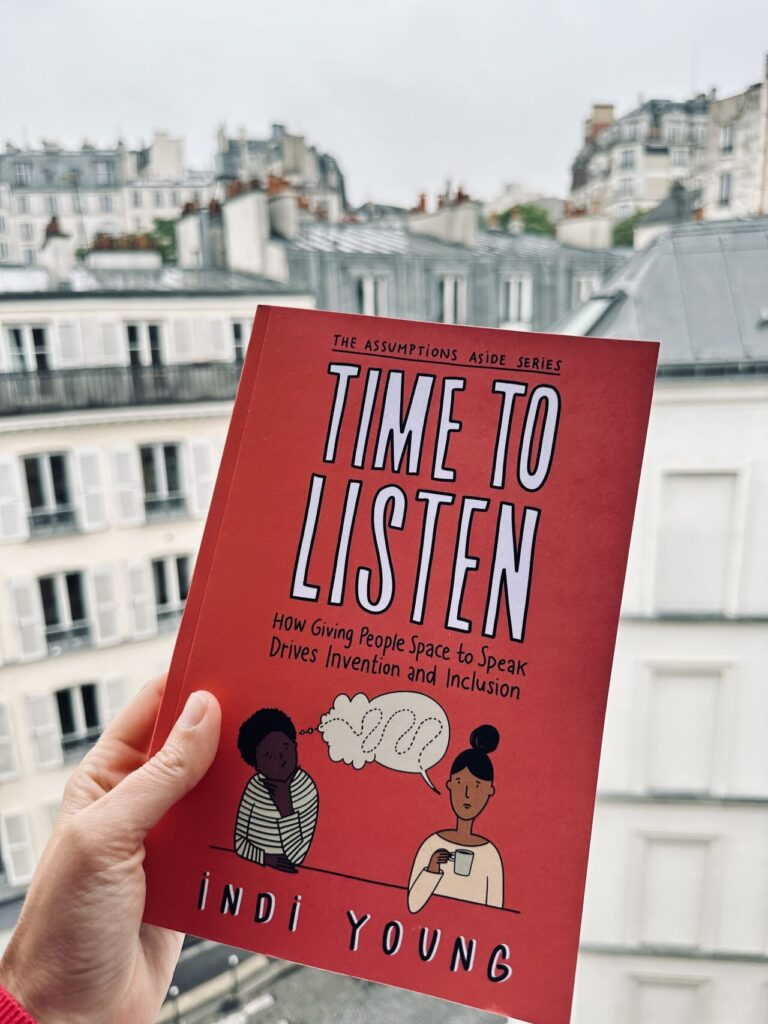 The cover of Time to Listen held by a hand