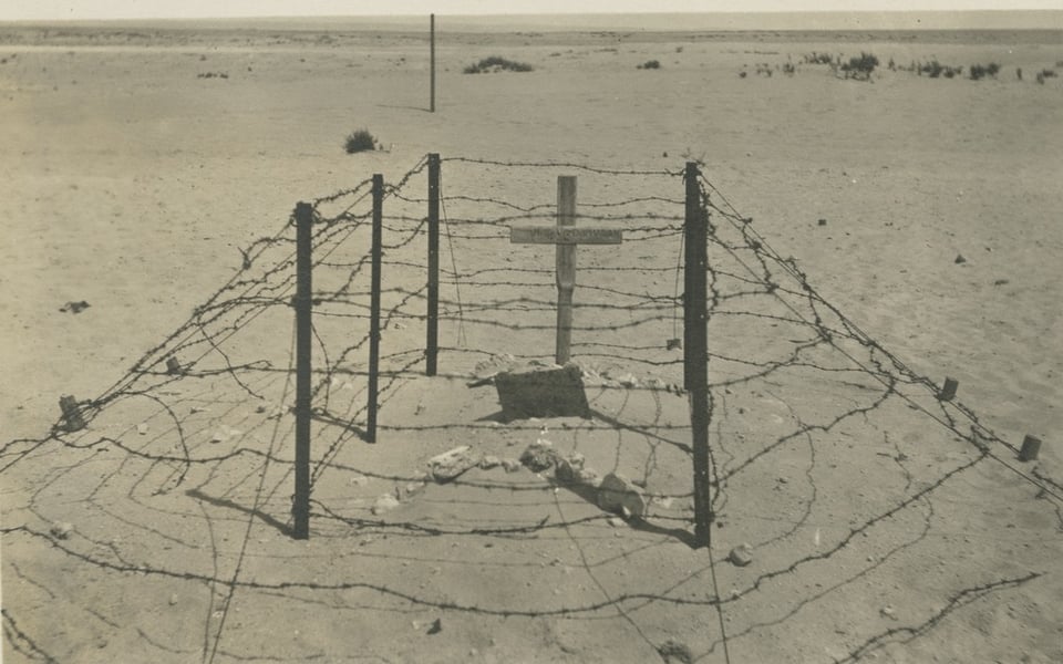 the loss is felt more keenly, far from home, a pointless war? a marker encased in barbed wire, unforgiving desert all around
