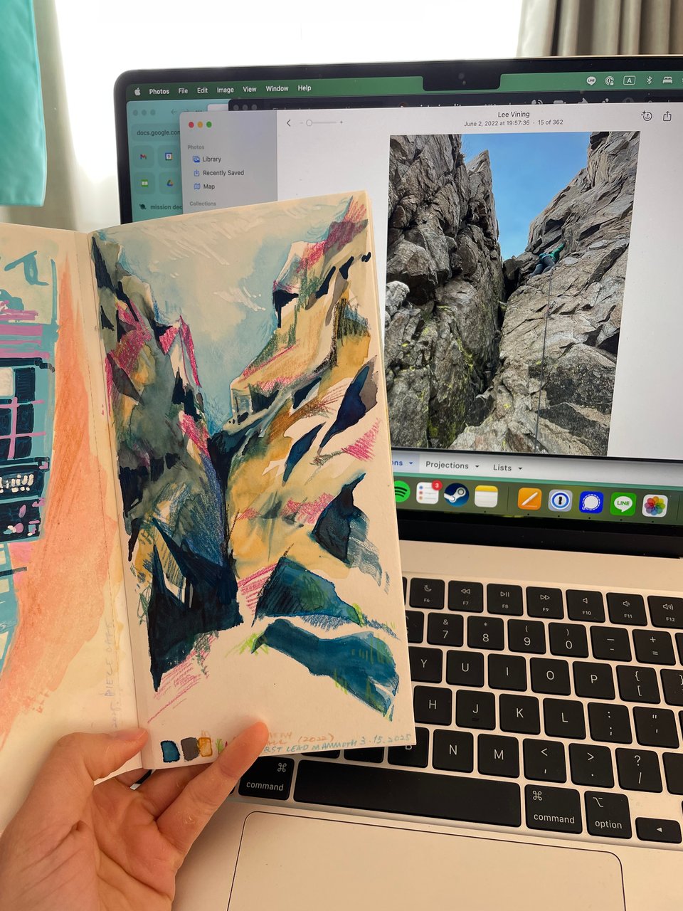A painting of rocks next to its reference photo.
