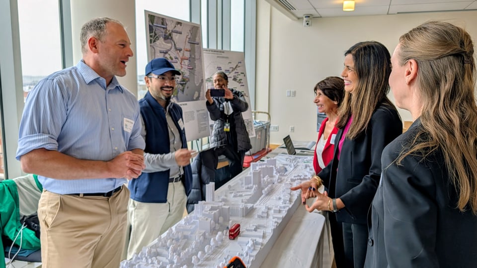 NJ Transit Chair & NJDOT Commissioner Priya Jain speaking with the Bergen Arches Preservation Coalition, learning about the project, and reviewing the model.