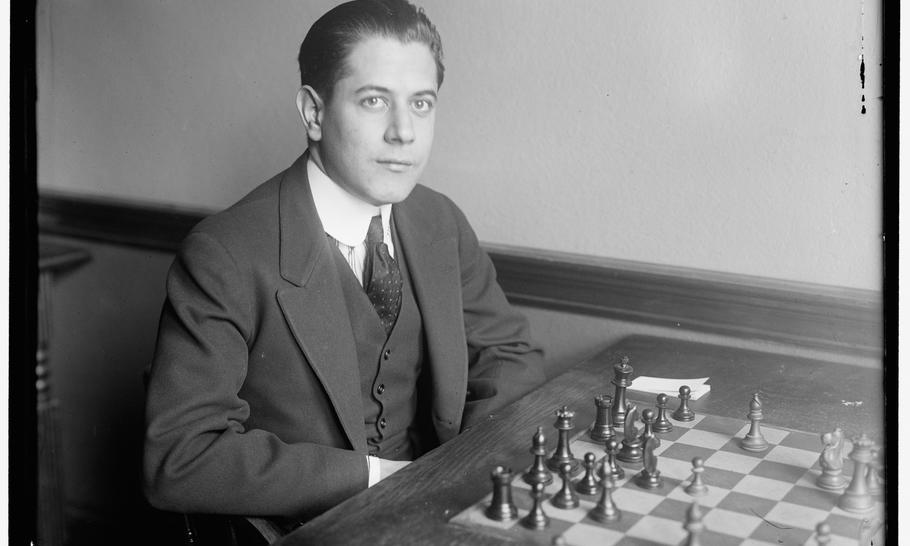 Capablanca at a chess board
