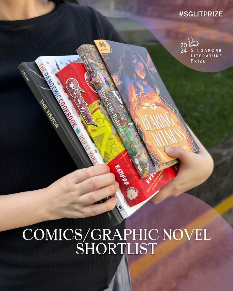 A person holding a stack of the shortlisted books for the Singapore Literature Prize's Comics/Graphic Novel category.