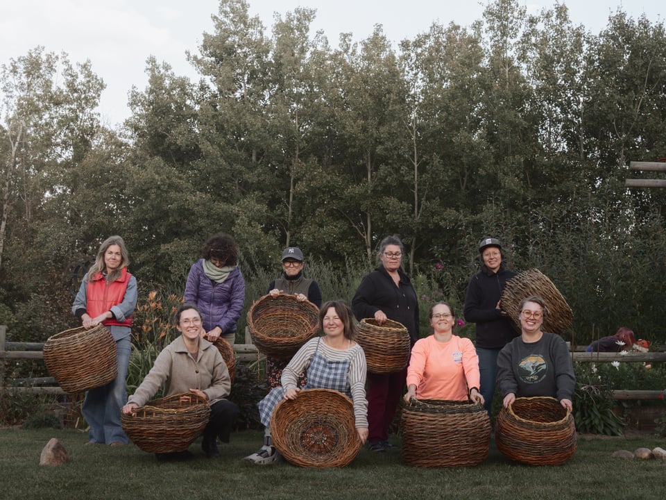 Basket weavers gathered in the garden at Baskets in the Garden 2026
