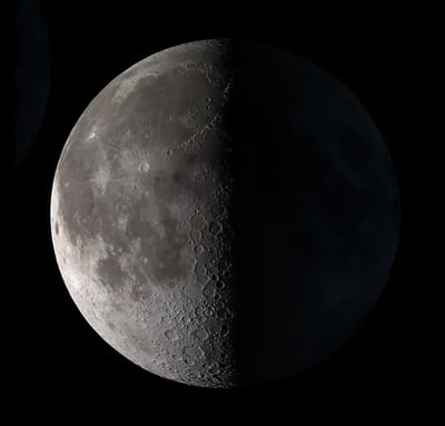 Square image of a third-quarter moon, bright on the left half, dark on the right half.