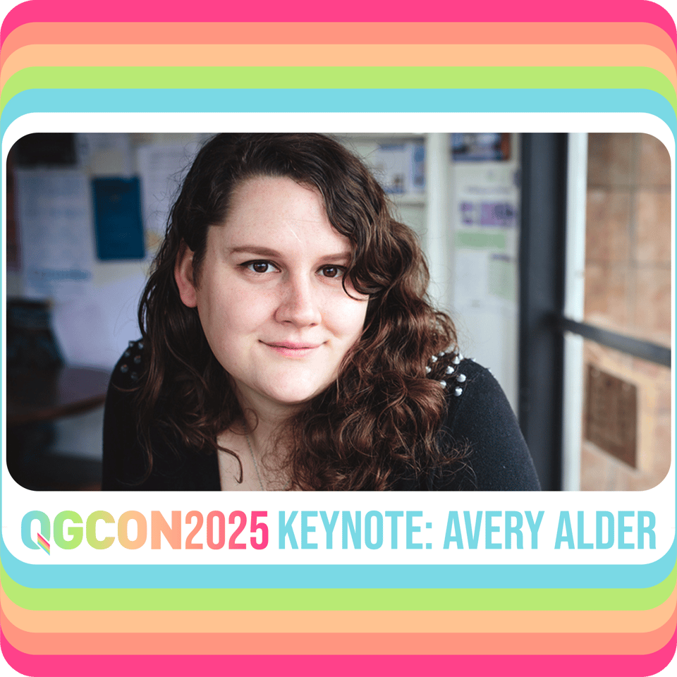 A portrait of Avery, a brown-haired woman wearing a studded sweater, bordered by QGCon's signature rainbow.