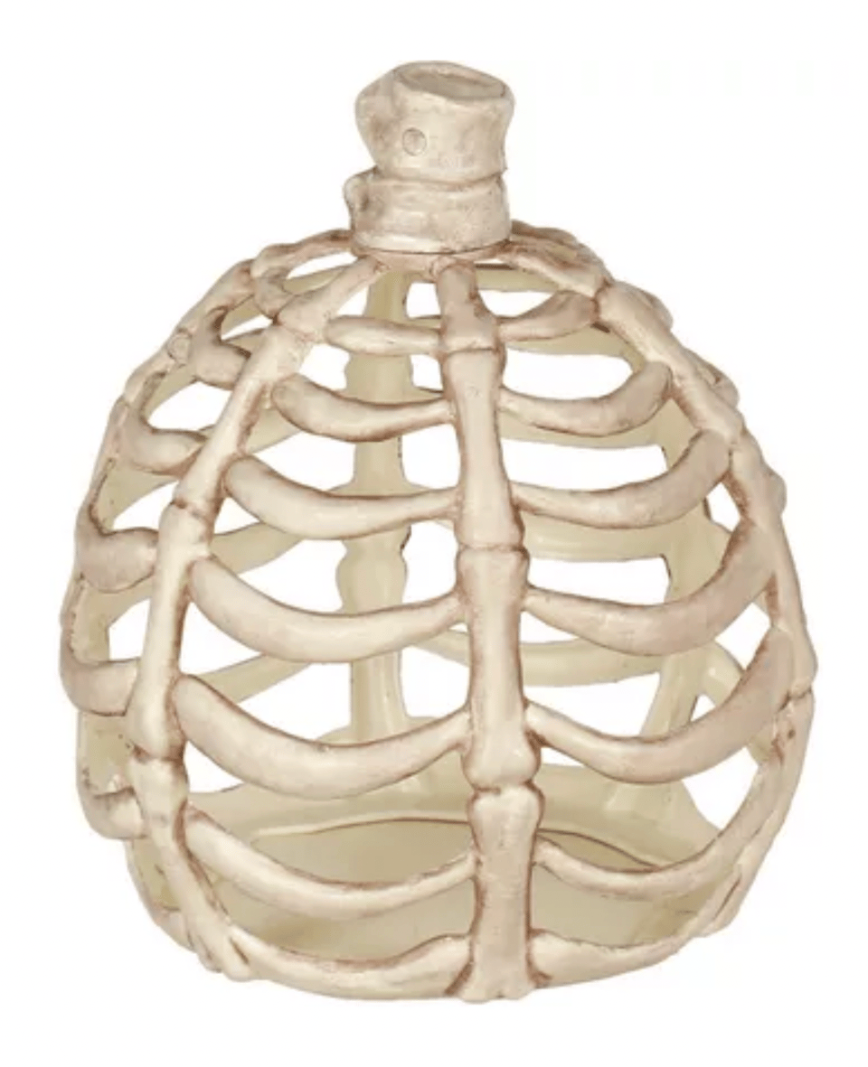 A plastic pumpkin formed from bones
