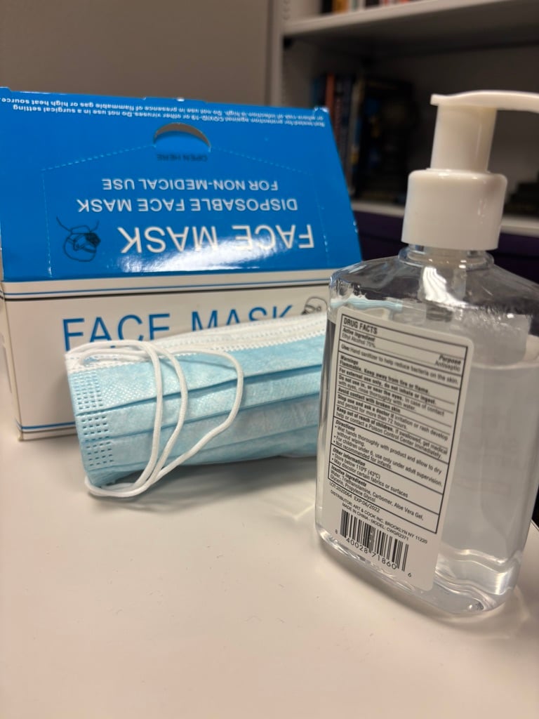 Image of masks and hand sanitizer.