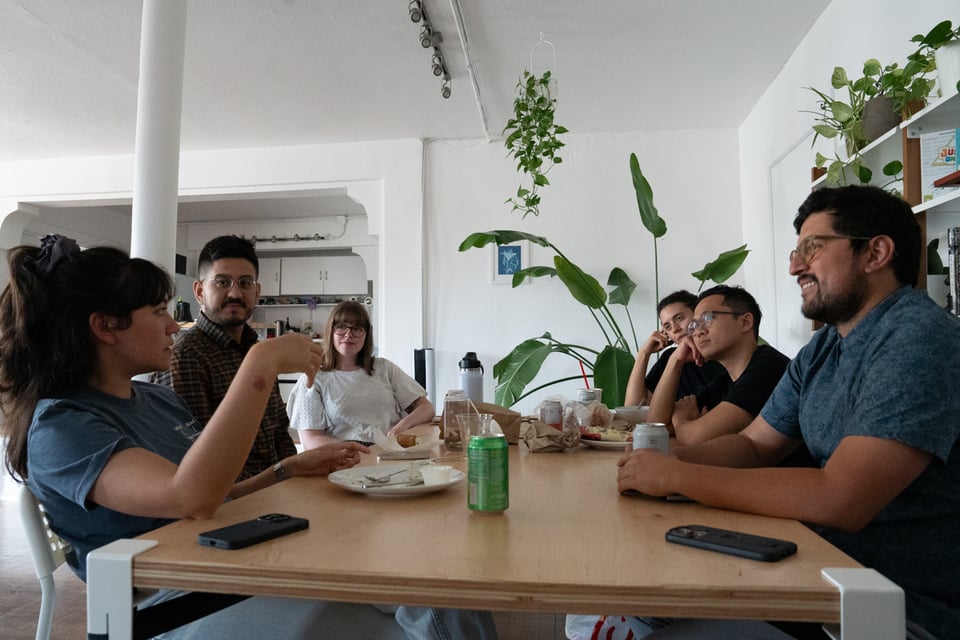 More people sitting around a table.