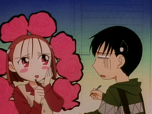 An animated GIF of a character from the anime series "Kare Kano" pretending to be adorable as red flowers pop up around her like an aura.
