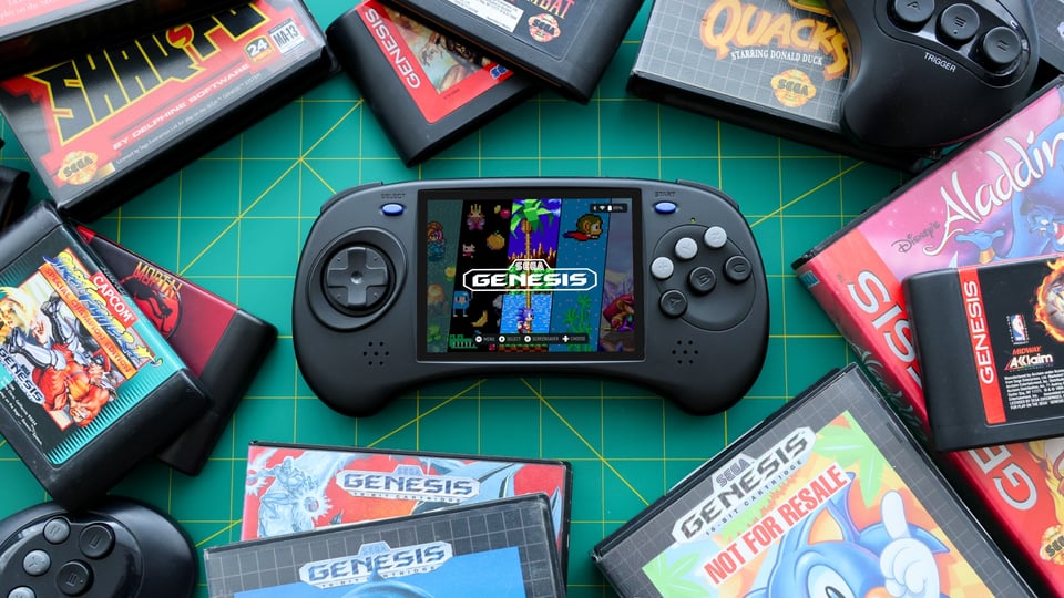 Anbernic RG-ARC surrounded by Genesis games