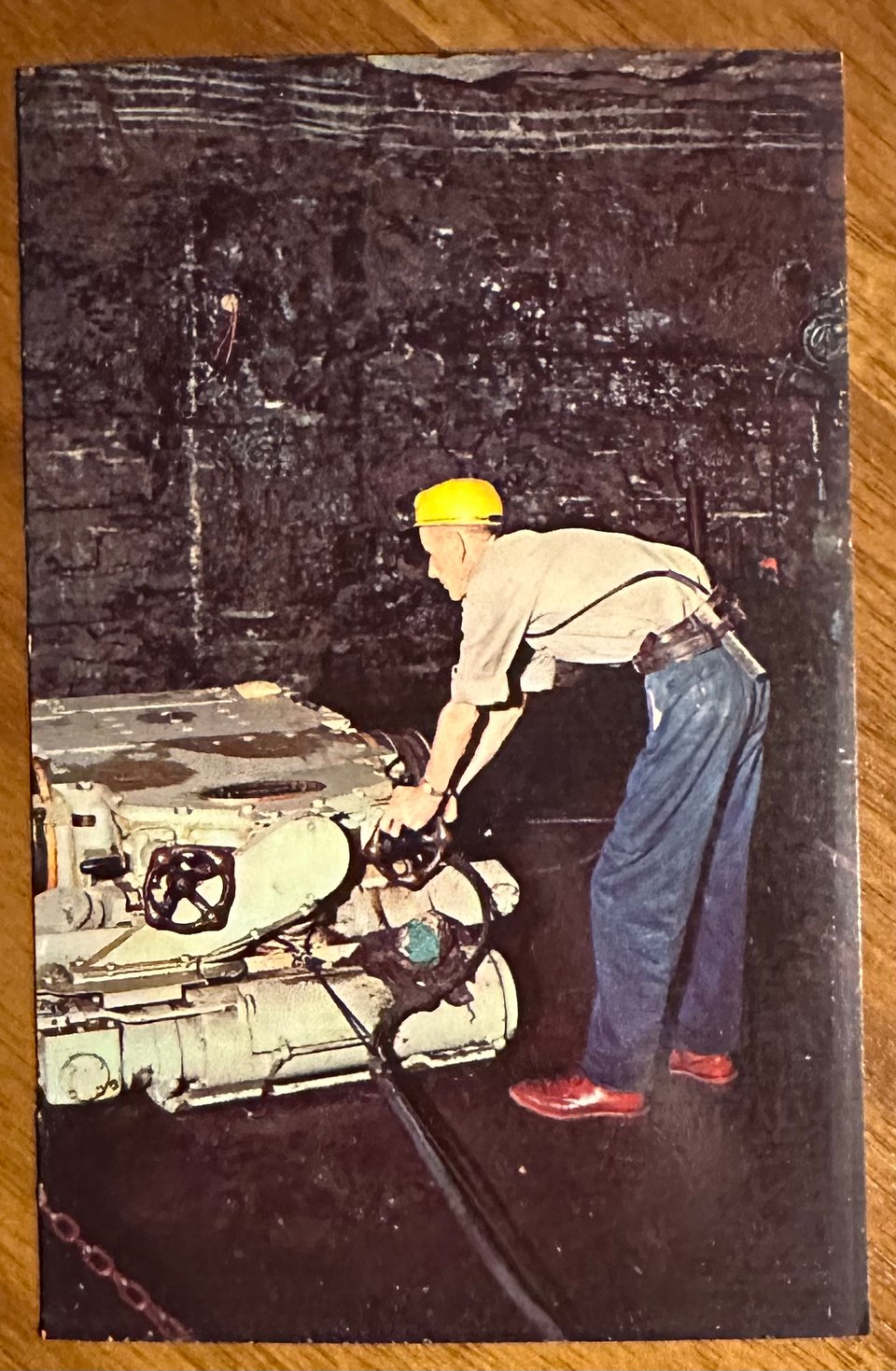 photo of a postcard of an automatic undercutting machine used by miners
