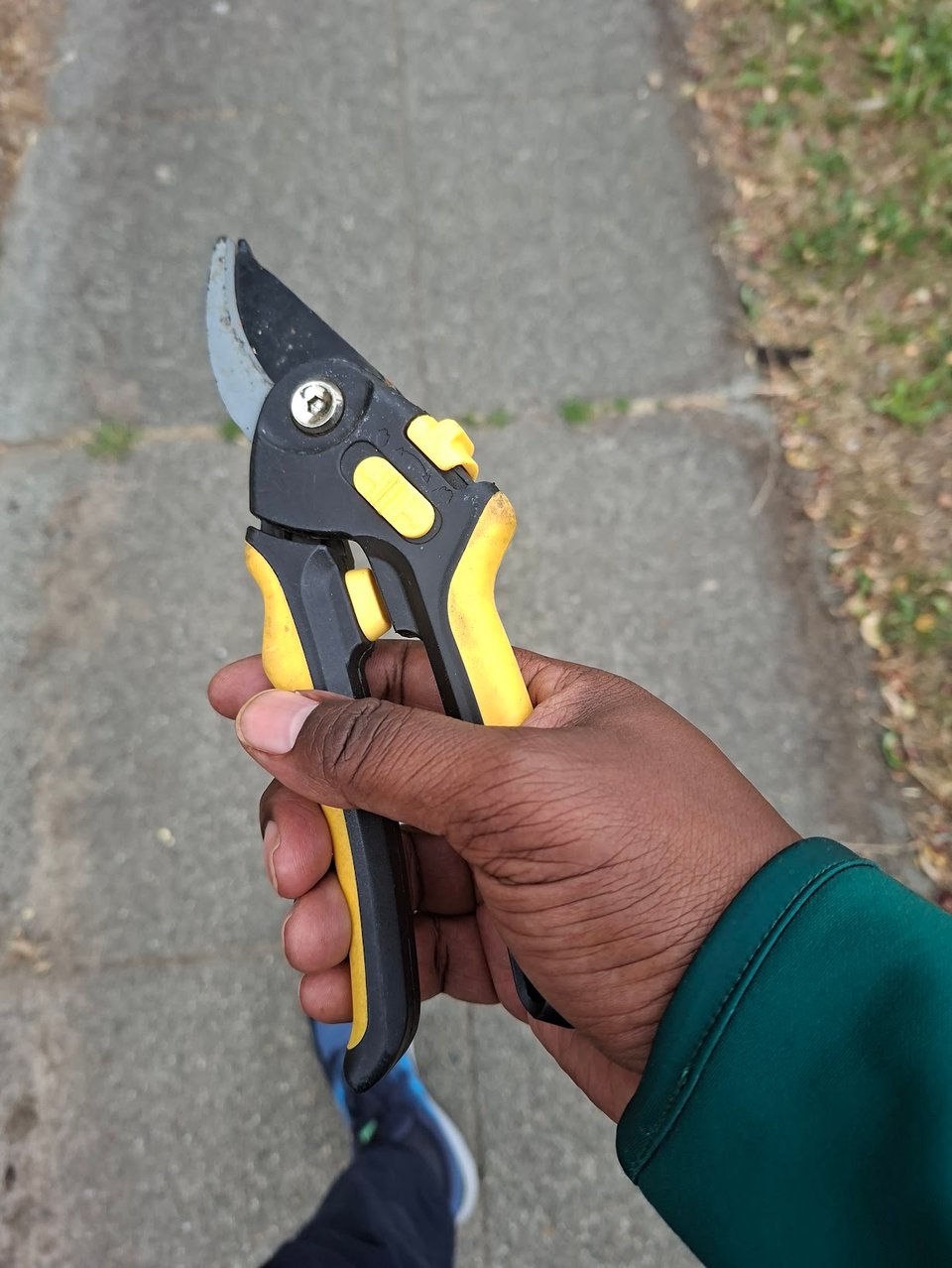 Yer boi carrying gardening shears