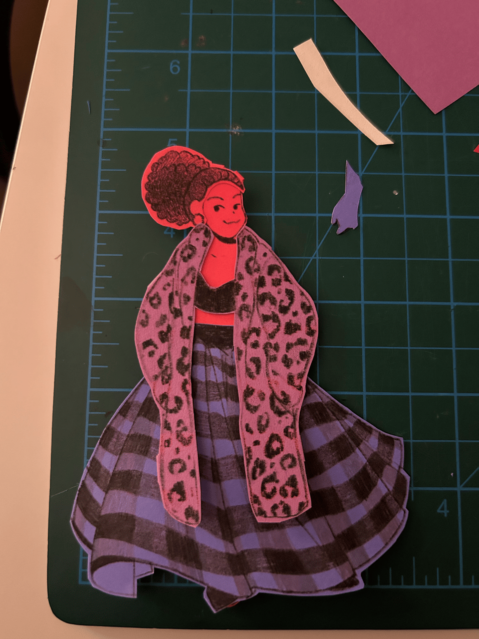 Paper doll made of different colored consturction paper.