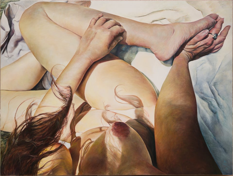 A painting by Joan Semmel showing a white woman's nude body—sitting, legs folded to the side in Z shape—as though the viewer is looking down, their POV aligned with the woman's (the artist's). Her left breast is mostly concealed by a lock of brown hair; her right breast in shadow of hanging hair. The subject is sitting on rumpled white sheets.
