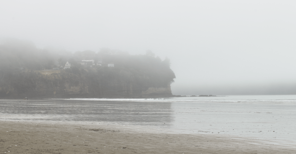 Orewa Beach with a morning fog