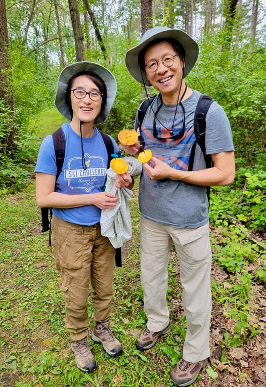 Park visitors Ruby Tam and Lewis Leung of St. Louis Park, Minn., were thrilled when they found some chanterelle mushrooms along a park trail two summers ago. The chants are popping again this summer—go find you some! / Photo by Pamela Miller