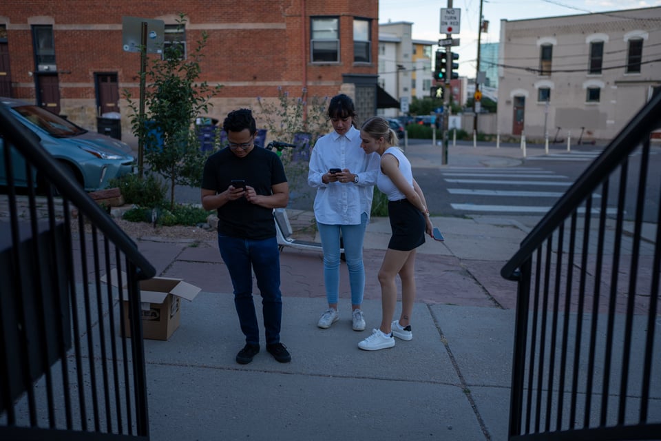 A group of people on phones.