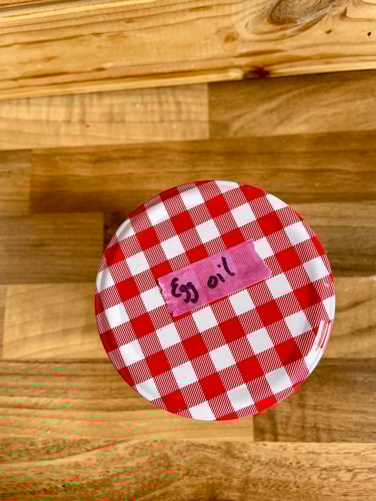 A jar labelled 'egg oil'