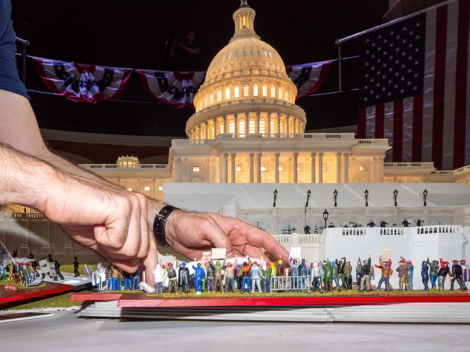 A player moves figures during the “Fight for America” game. (Peter van Agtmael/Magnum Photos for The Washington Post)