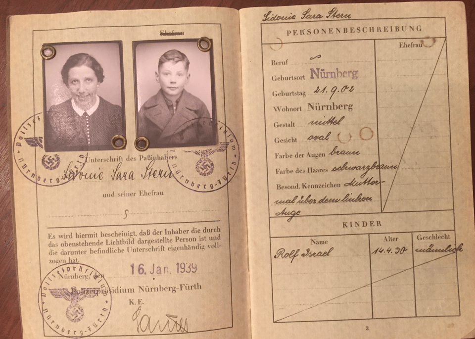Two inside pages of the passport, with German text, a date stamp of 16 January 1939, and photos of a woman and a 9-year-old boy