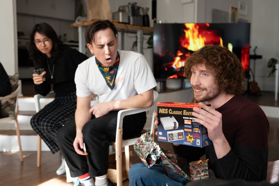 Mason holding a new old video game console.