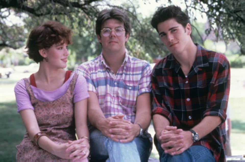Molly Ringwald, John Hughes, and Michael Schoeffling on the set of "Sixteen Candles."