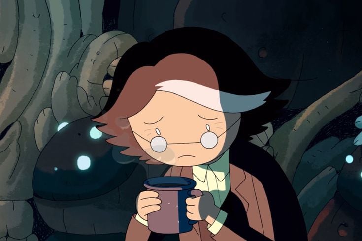 a person holding a cup of tea