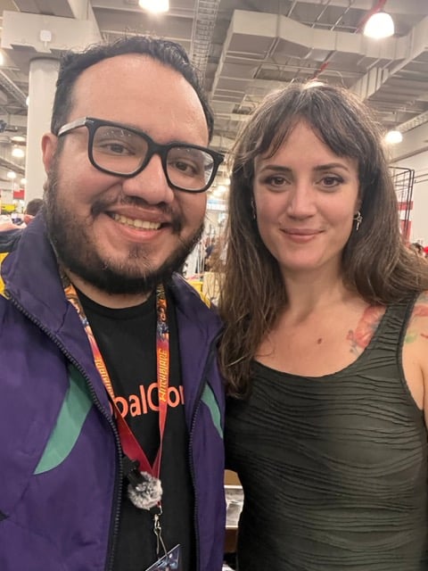 two people at a comic book convention.