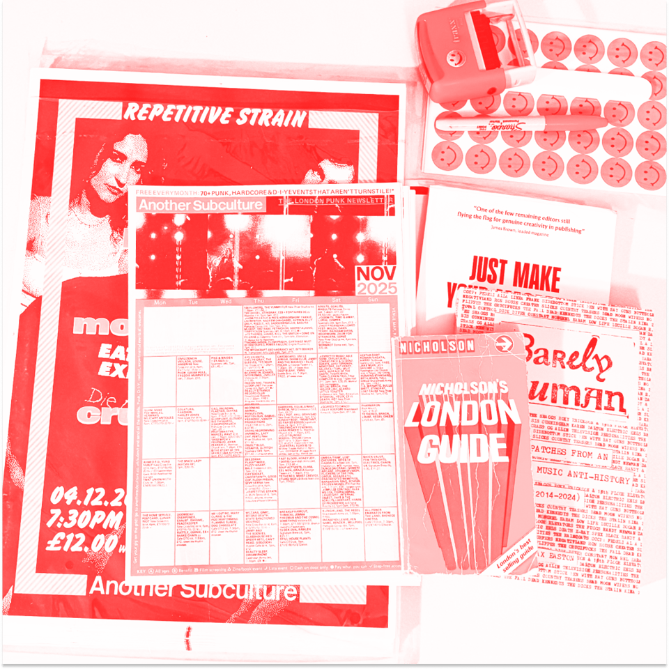 Our dining table this month: November's listings, posters for the Blue Zero gig in December, postage supplies and a few books I've been reading...