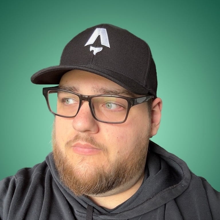 a man with glasses and a hat