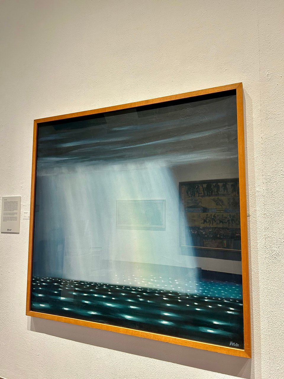 A painting of a heavy rain shower over dark green and blue sea.