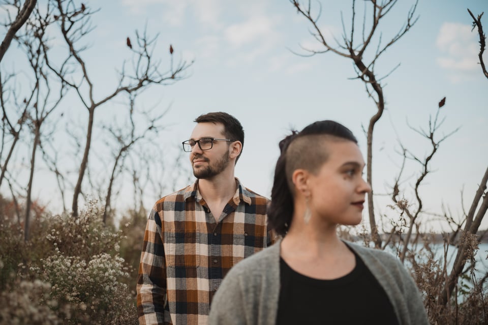 an artistic shot of a couple looking in opposite directions