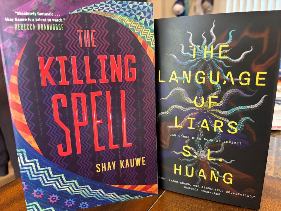 Books The Killing Spell by Shay Kauwe and The Language of Liars by S. L. Huang