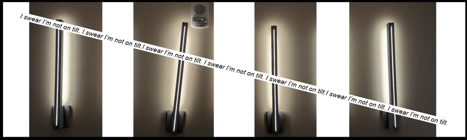 Four light fixtures in four different panels. The fixture in the second panel is slightly tilted and also has a fire alarm.