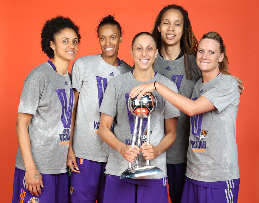 The 2014 Phoenix Mercury starters posing with the championship trophy: Candice Dupree, DeWanna Bonner, Diana Taurasi, Brittney Griner, and Penny Taylor